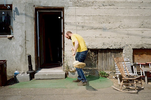 Budwig tidying up the famous AstroTurf behind the OK Theatre: Photo by Matt Kennelly