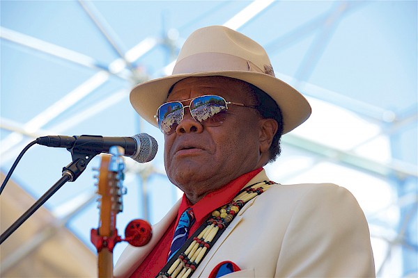 Norman Sylvester surveys the Waterfront Blues Festival crowd for the umpteenth time—he played the inaugural fest in 1987 and almost every year since: Photo by John Alcala